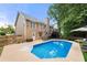 A refreshing backyard pool with a spacious patio and comfortable seating for outdoor relaxation at 2775 Harper Ferry Dr, Lawrenceville, GA 30044