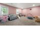 Basement with carpet, a large window, and furniture, perfect for a playroom or entertaining space at 2775 Harper Ferry Dr, Lawrenceville, GA 30044