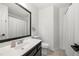 Bathroom with black vanity, tile floors, and a shower with white curtain at 2775 Harper Ferry Dr, Lawrenceville, GA 30044