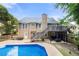 The exterior of the house shows a deck, a patio and an inground pool at 2775 Harper Ferry Dr, Lawrenceville, GA 30044