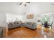 Spacious living area open to the dining room, hardwood floors, and neutral decor, perfect for entertaining at 2775 Harper Ferry Dr, Lawrenceville, GA 30044