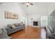 Bright living room featuring a vaulted ceiling, hardwood floors, fireplace, and ample natural light at 2775 Harper Ferry Dr, Lawrenceville, GA 30044