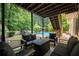 Backyard patio boasts comfortable seating and a view of the refreshing inground pool at 2775 Harper Ferry Dr, Lawrenceville, GA 30044