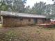 Brick home featuring a wooden deck surrounded by a yard at 4595 Sahara Sw Dr, Atlanta, GA 30331