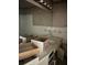 Bathroom featuring a large mirror, white tile, and damaged drawers at 4595 Sahara Sw Dr, Atlanta, GA 30331