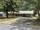 Cozy single-story brick house with a long driveway and mature trees at 4595 Sahara Sw Dr, Atlanta, GA 30331