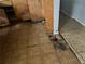 Damaged kitchen with damaged floors, cabinets, and walls at 4595 Sahara Sw Dr, Atlanta, GA 30331