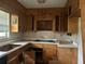 Outdated kitchen featuring worn cabinetry and countertops in need of a refresh at 4595 Sahara Sw Dr, Atlanta, GA 30331