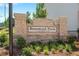 Elegant stone entrance sign reading 