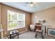 Bedroom with ample natural light from a large window and neutral color scheme at 80 Jacob Trl, Rockmart, GA 30153