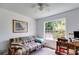 Bright bedroom with natural light, futon, and desk space provides a functional layout at 80 Jacob Trl, Rockmart, GA 30153
