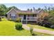 Charming home with a welcoming front porch and well-maintained landscaping at 80 Jacob Trl, Rockmart, GA 30153