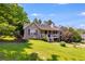 Beautiful home exterior featuring a covered porch and lush greenery at 80 Jacob Trl, Rockmart, GA 30153
