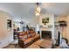 Open concept living room with a fireplace, and seamlessly connected to dining area at 80 Jacob Trl, Rockmart, GA 30153