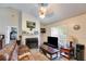Comfortable living room with a fireplace, sofa, and large window at 80 Jacob Trl, Rockmart, GA 30153