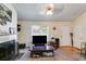 Cozy living room with a fireplace, neutral colors, and natural lighting at 80 Jacob Trl, Rockmart, GA 30153
