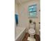 Bathroom with a tub/shower combination, plant and a window at 1081 Hardin Street Sw St, Conyers, GA 30012