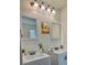 Stylish bathroom vanity with dual sinks, decorative mirrors and modern fixtures at 1081 Hardin Street Sw St, Conyers, GA 30012