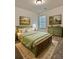 Bedroom with country-style furniture, carpet, and paintings on the wall at 1081 Hardin Street Sw St, Conyers, GA 30012