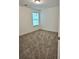 Bright bedroom with neutral carpeting and a window providing natural light at 1081 Hardin Street Sw St, Conyers, GA 30012
