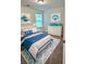 Bright bedroom features neutral walls, carpet, and furnishings in a nautical theme at 1081 Hardin Street Sw St, Conyers, GA 30012