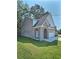 Charming two-story brick home with a covered entryway and an attached garage at 1081 Hardin Street Sw St, Conyers, GA 30012