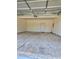 Empty garage with a concrete floor and a door at 1081 Hardin Street Sw St, Conyers, GA 30012