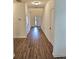 Inviting entryway with wood floors, a staircase, and doors leading to various rooms at 1081 Hardin Street Sw St, Conyers, GA 30012