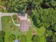 Aerial view of the property, showcasing the landscaping, patio, and surrounding trees at 1625 Bill Murdock Rd, Marietta, GA 30062