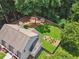 Aerial view of the home showcasing the expansive, fenced backyard and its mature tree coverage at 1625 Bill Murdock Rd, Marietta, GA 30062