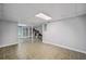 Basement with tile floors, neutral-colored walls, open layout, and a partially finished area at 1625 Bill Murdock Rd, Marietta, GA 30062
