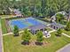 Aerial view of community tennis courts, clubhouse, fire pit and landscaping at 1625 Bill Murdock Rd, Marietta, GA 30062
