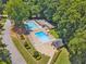 An aerial view shows a community pool with lounge chairs and ample space for relaxation at 1625 Bill Murdock Rd, Marietta, GA 30062