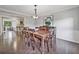 Elegant dining area with hardwood floors and open access to the kitchen at 1625 Bill Murdock Rd, Marietta, GA 30062