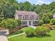 Beautifully landscaped home featuring manicured lawn and a stone walkway to the front entrance at 1625 Bill Murdock Rd, Marietta, GA 30062