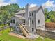 Home exterior features a deck, patio, two-car garage, and lush greenery at 1625 Bill Murdock Rd, Marietta, GA 30062