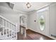 Welcoming foyer with hardwood floors and a charming front door with decorative glass at 1625 Bill Murdock Rd, Marietta, GA 30062