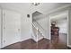 Inviting foyer showcasing hardwood floors, a staircase, and a glimpse into the dining room at 1625 Bill Murdock Rd, Marietta, GA 30062