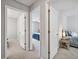 Hallway with open bedroom doors showing carpeted floor, walls painted in neutral color, and natural light at 1625 Bill Murdock Rd, Marietta, GA 30062