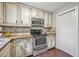 Well-appointed kitchen showcasing updated appliances, and ample cabinet space at 1625 Bill Murdock Rd, Marietta, GA 30062