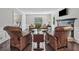 Bright living room boasts hardwood flooring, a fireplace, and comfortable seating at 1625 Bill Murdock Rd, Marietta, GA 30062