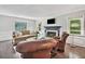 Comfortable living room features a fireplace, hardwood floors, and natural light at 1625 Bill Murdock Rd, Marietta, GA 30062