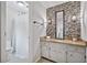 Well-lit main bathroom features a modern vanity with beautiful tile backsplash at 1625 Bill Murdock Rd, Marietta, GA 30062