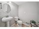 Cozy powder room features pedestal sink and tiled floors at 1625 Bill Murdock Rd, Marietta, GA 30062