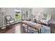 Bright sitting room features a zebra-print ottoman, hardwood floors, and lots of light at 1625 Bill Murdock Rd, Marietta, GA 30062