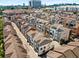 Aerial view of townhome community with city skyline in the background at 506 Broadview Ne Pl, Atlanta, GA 30324