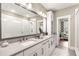 Spacious bathroom with double vanity, large mirror, and walk-in shower, offering luxury and convenience at 506 Broadview Ne Pl, Atlanta, GA 30324