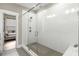 Modern bathroom featuring a glass shower with white subway tiles and a rain shower head at 506 Broadview Ne Pl, Atlanta, GA 30324