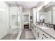 Bright bathroom with walk-in shower, double vanity, and modern finishes, providing a spa-like experience at 506 Broadview Ne Pl, Atlanta, GA 30324