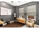 Charming bedroom featuring modern decor, a comfortable chair, and bright natural light at 506 Broadview Ne Pl, Atlanta, GA 30324